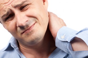 Young businessman with neck pain